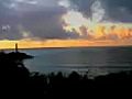 Royalty Free Stock Video SD Footage Light Beacon Flashes Light at Sunrise on Beach in Kauai,  Hawaii