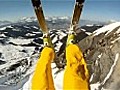 Skier hurtles off cliff followed by avalanche