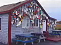 Royalty Free Stock Video SD Footage Colorful Lobster Boueys Hang on a Small Building Outside of Rockport,  Massachusetts