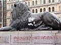 Morning light shows London landmarks stained with graffiti