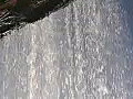 Royalty Free Stock Video HD Footage Pan Left to a Rushing Waterfall from a Small Stream in North Carolina