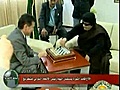 Gaddafi plays chess as war rages