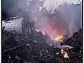 Raw Video: Plane crash wreckage in Congo