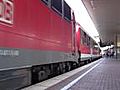 110 497-5 mit dem RE 1 nach Hamm bei der Abfahrt in Duisburg Hbf mit Pfiff am 18.07.2010