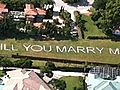 Man Proposes In Midair,  Paints Question On Lawn