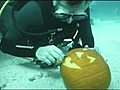 Underwater pumpkin carving contest