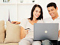 Young Couple Sharing a Laptop