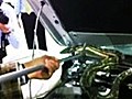 Snake crawls inside car engine