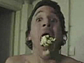 Man pops popcorn in his mouth