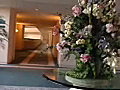 Royalty Free Stock Video SD Footage Zoom Out of Floral Arrangement in Hotel Lobby