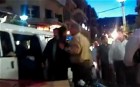 Syrian police bundle protesters into van