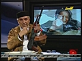 Libyan TV host has gun on show