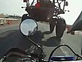 Motorcycle Drives Under Truck