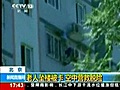 Beijing man rescued after dangling from highrise