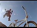 BMX trickster swaps bikes mid-jump