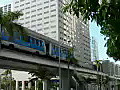 Royalty Free Stock Video HD Footage People Mover Transit Station and High Rise Condos,  Office Buildings as People Mover Car Arrives in Downtown Miami, Florida