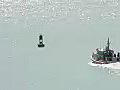 Royalty Free Stock Video HD Footage US Coast Guard Patrol Boat Heads Out to Sea at the Harbor at Honolulu,  Hawaii