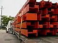 Royalty Free Stock Video SD Footage Zoom Out to Load of Steel Girders on a Truck