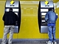 Two men charged over ATM windfall