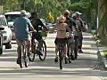 Royalty Free Stock Video HD Footage Traffic and Bicycle Riders on Duvall Street in Key West Florida