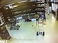 Wine shelf collapses on clerk