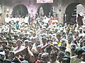 Indian Hindu devotees throw colours during Holi celebrations