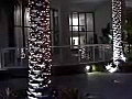 Royalty Free Stock Video SD Footage Pan Right to Holiday Lights and Water Fountain on the New River in Downtown Ft. Lauderdale,  Florida