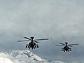 Apache Helicopters In Snowy Mountains Stock Footage