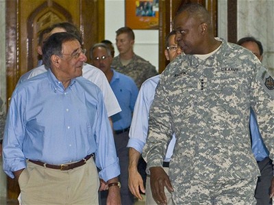 New defense secretary visits war zones