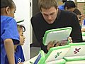 Brady passes out laptops at Boston Boys and Girls club