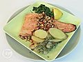 Rainbow trout with thyme,  pine nuts and garlic spinach