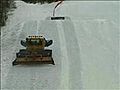 Jump over snowcat snowboarding