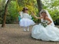 bride with small angel on a swing