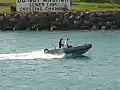 Royalty Free Stock Video HD Footage Small Powerboat Passes by in the Harbor at the Port of Honolulu,  Hawaii