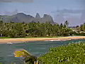 Royalty Free Stock Video SD Footage Static Shot of Mountain Range and Inlet at Sunrise on Beach in Kauai,  Hawaii