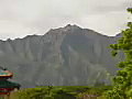 Royalty Free Stock Video SD Footage Quick Zoom Out From Mountain to Pagoda at Kauai Community College in Kauai,  Hawaii