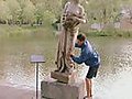 Statue Falling Into Water