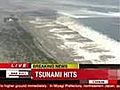 Tsunami waves close in on Japan