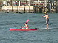Royalty Free Stock Video HD Footage Kayak and Surfboard Pass by at the Inlet in Jupiter,  Florida