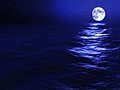 (1031) Full Blue Moon Rising Over Blue Night Ocean Stock Footage