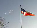 Royalty Free Stock Video HD Footage American Flag Waving and Bright Sun