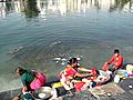 Bathing and washing ladies in India