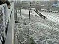 Tsunami engulfs car and passengers