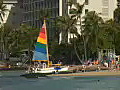 Royalty Free Stock Video HD Footage Catamaran on the Beach at Waikiki in Honolulu,  Hawaii