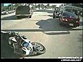 Motorcycle crashes into intersection!