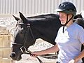 Woman Leading Horse Stock Footage