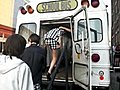 Models Boarding a Bus