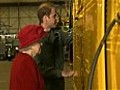 Prince William shows Queen around the Sea King