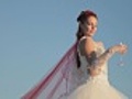 bride poses with a glass of champagne