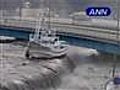 Tsunami waves send ships crashing into highway